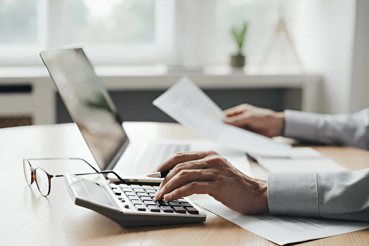 Professionals working with calculator and documents